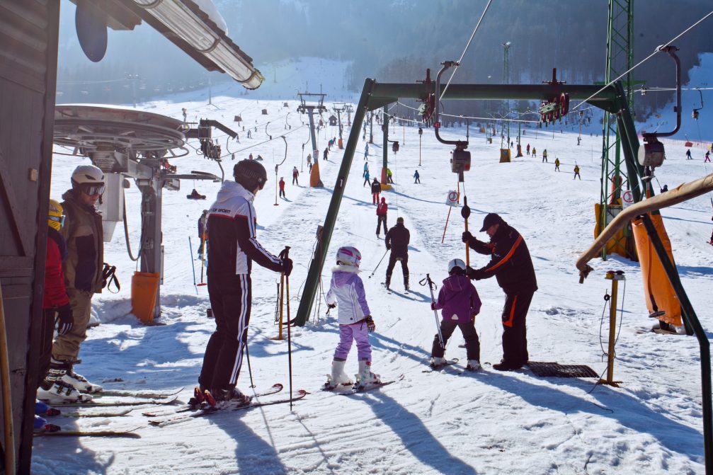 A group of children using T-bars lifts Kranjska Gora Ski Resort