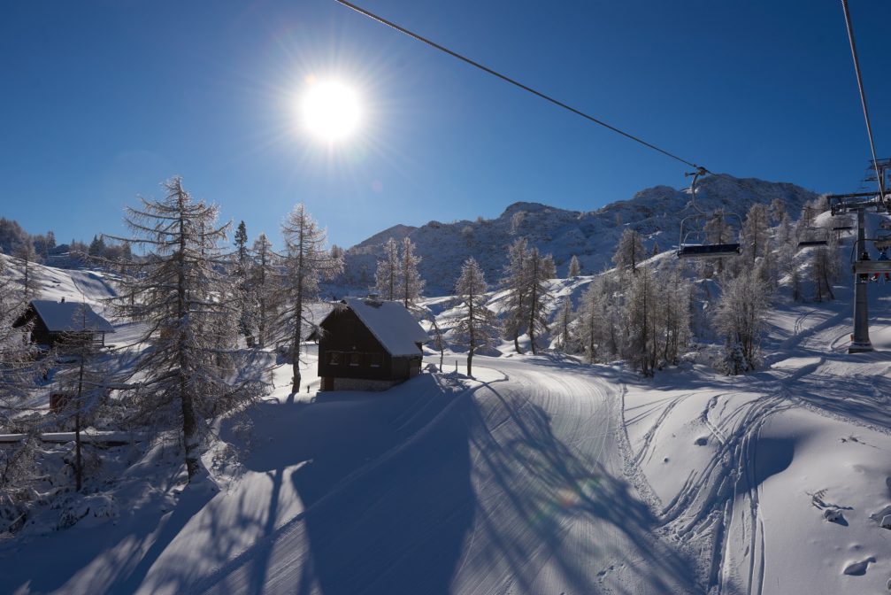 Chairlifts above well maintained tracks at Vogel Ski Resort in Slovenia