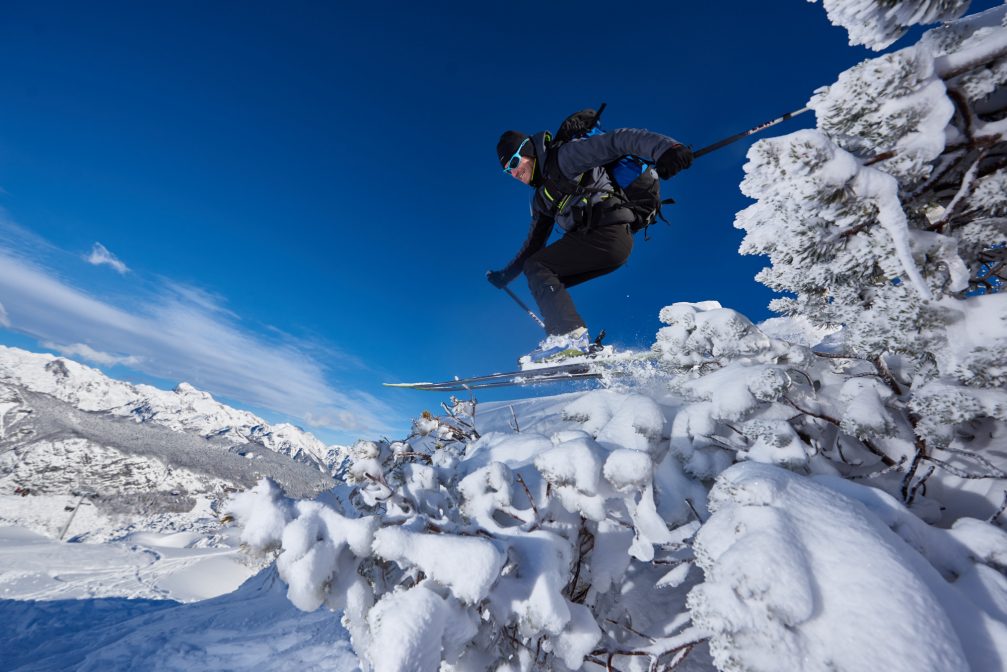 A skier enjoying freeride skiing at Vogel Ski Resort in Bohinj, Slovenia