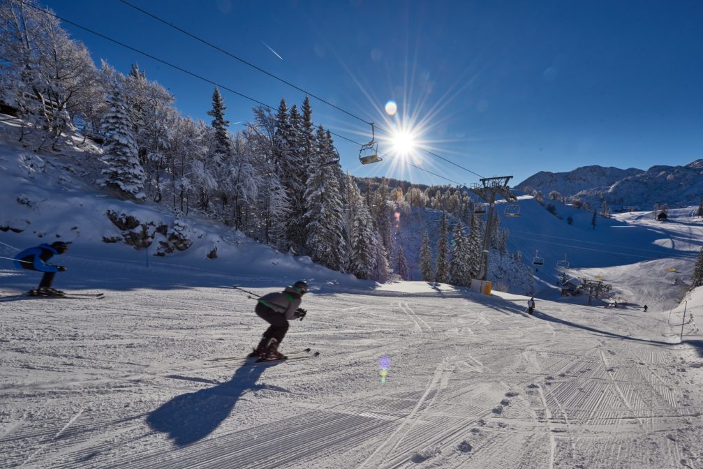 A skier skiing at Vogel Ski Resort in Bohinj, Slovenia