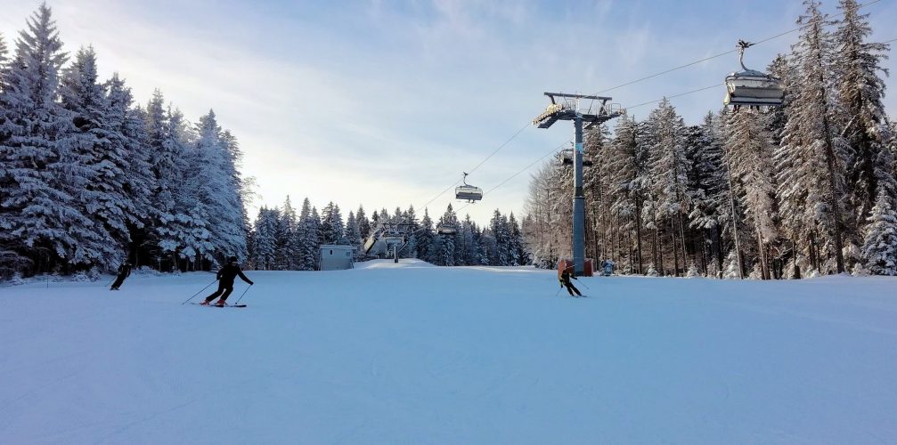 A group of skiers on the slopes of Maribor Pohorje Ski Resort in Slovenia