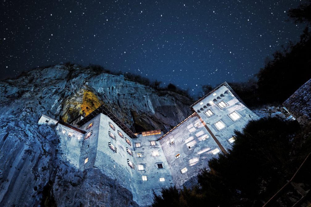 Exterior of Predjama Castle near Postojna at night  