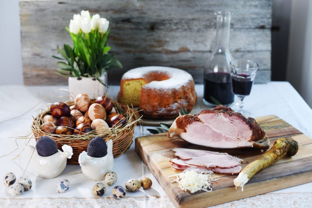 Traditional Slovenian Easter Breakfast with ham, Potica, eggs and horseradish