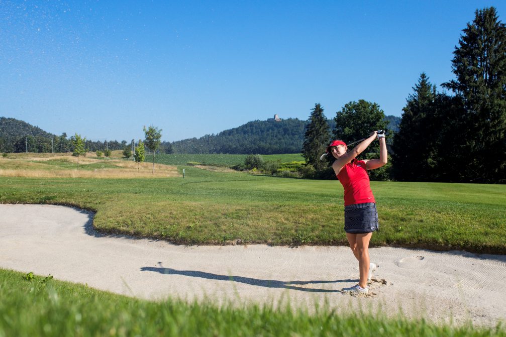 A golfer shot ball from sand bunker at Diners CUBO Ljubljana Golf Course in Slovenia