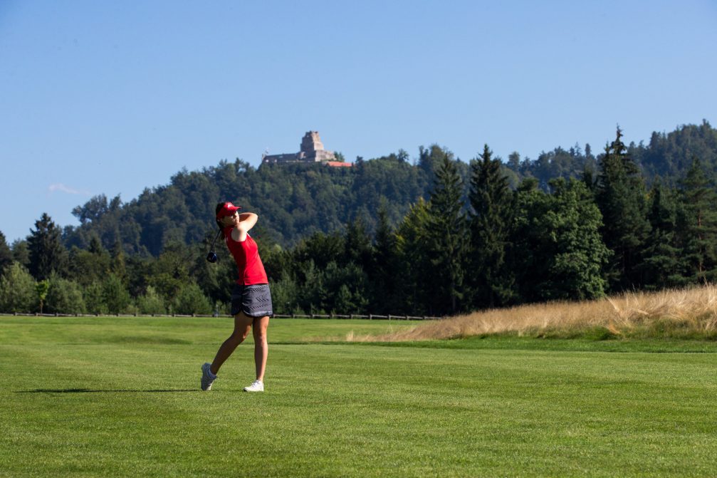 A female golfer playing a round at Diners CUBO Ljubljana Golf Course in Slovenia