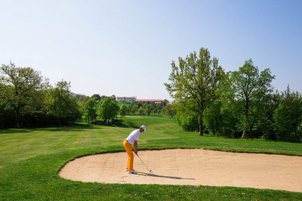 Golfer in the sand bunker at Lipica Golf Course in Slovenia