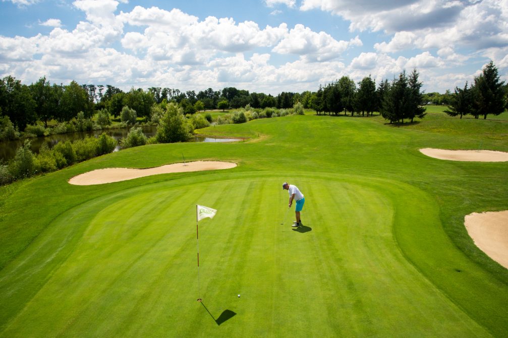 Male golfer putting at Livada Golf Course In Moravske Toplice