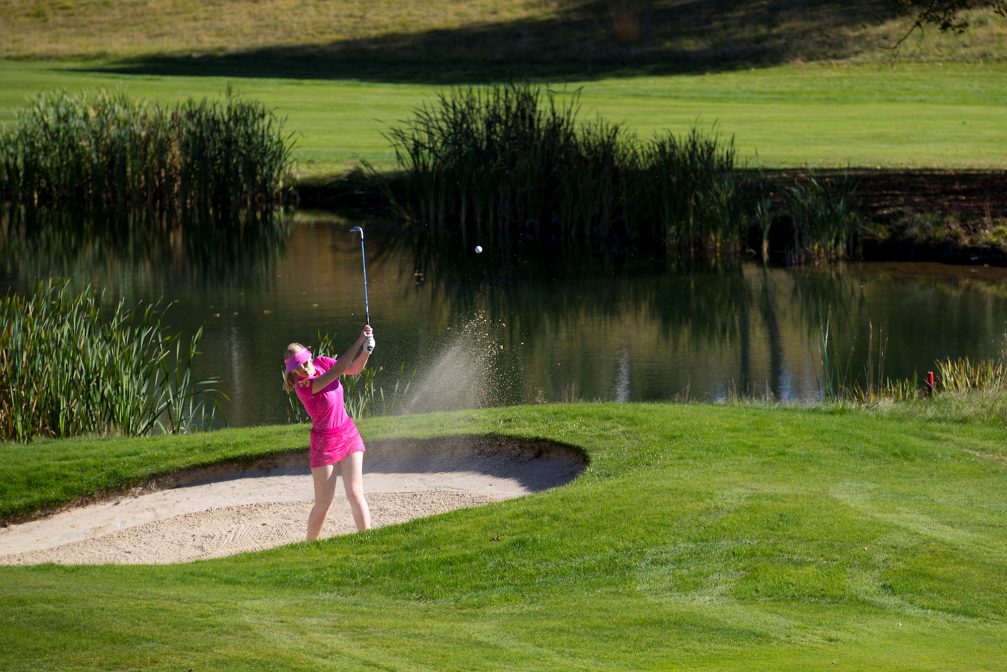 A golfer shot ball from sand bunker at Kings Course at Royal Bled Golf in Slovenia