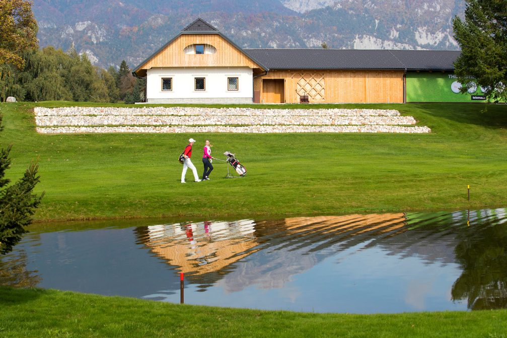 A couple walking at Kings Course at Royal Bled Golf in Slovenia