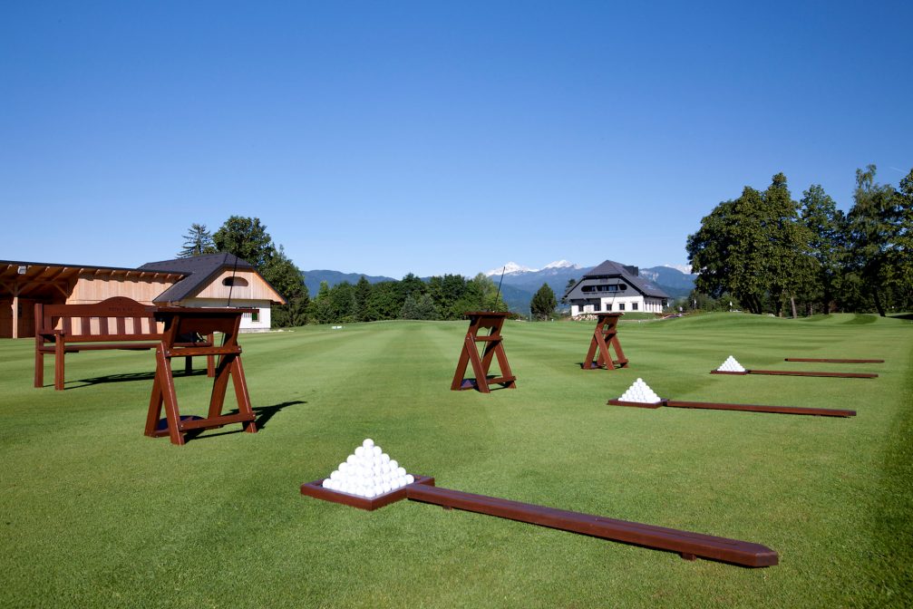 Practice area and the clubhouse at Royal Bled Golf in Slovenia