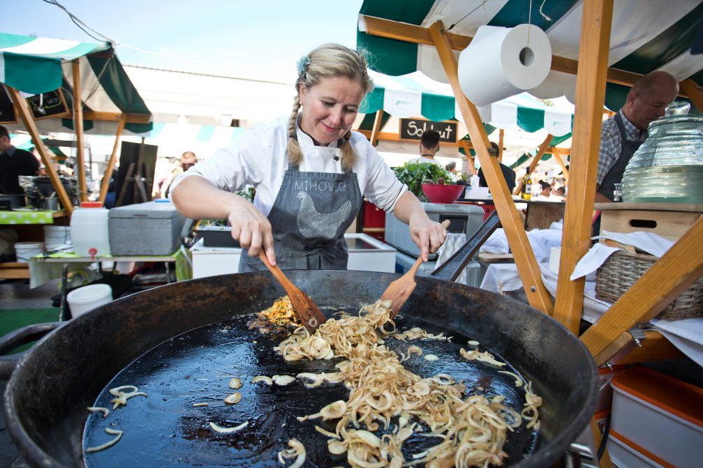 Cooking at Open Kitchen gourmet open air food market in Ljubljana