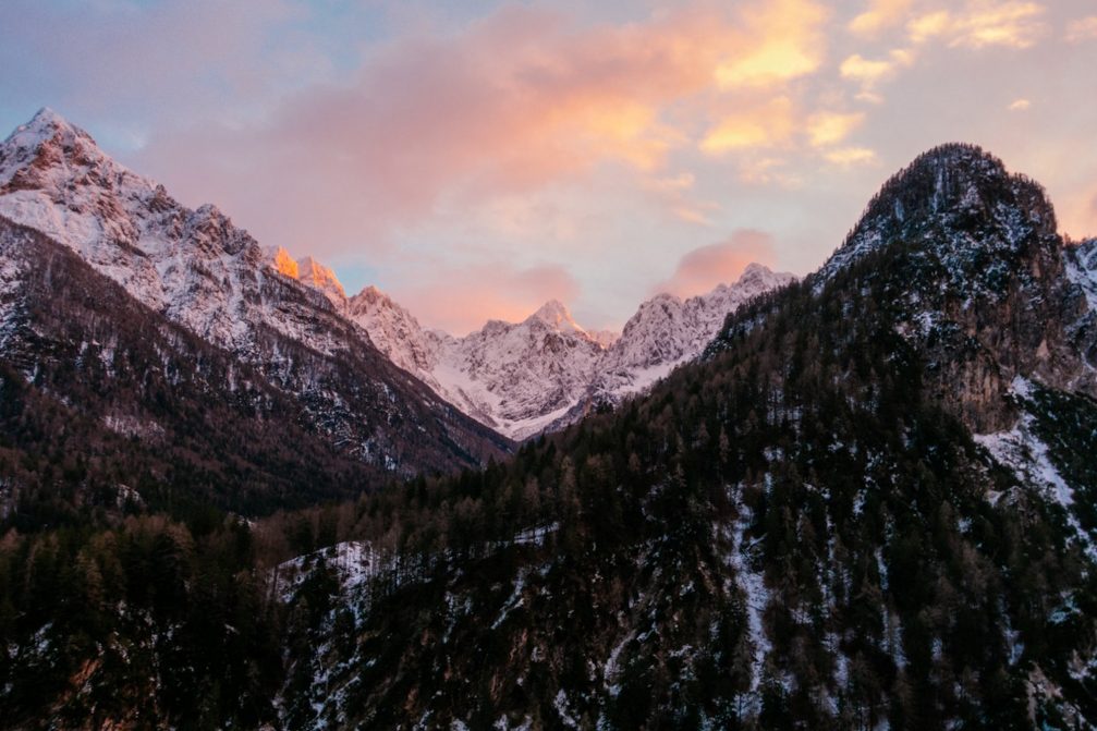 View of Prisojnik or Prisank mountain above Lake Jasna in Julian Alps at sunset