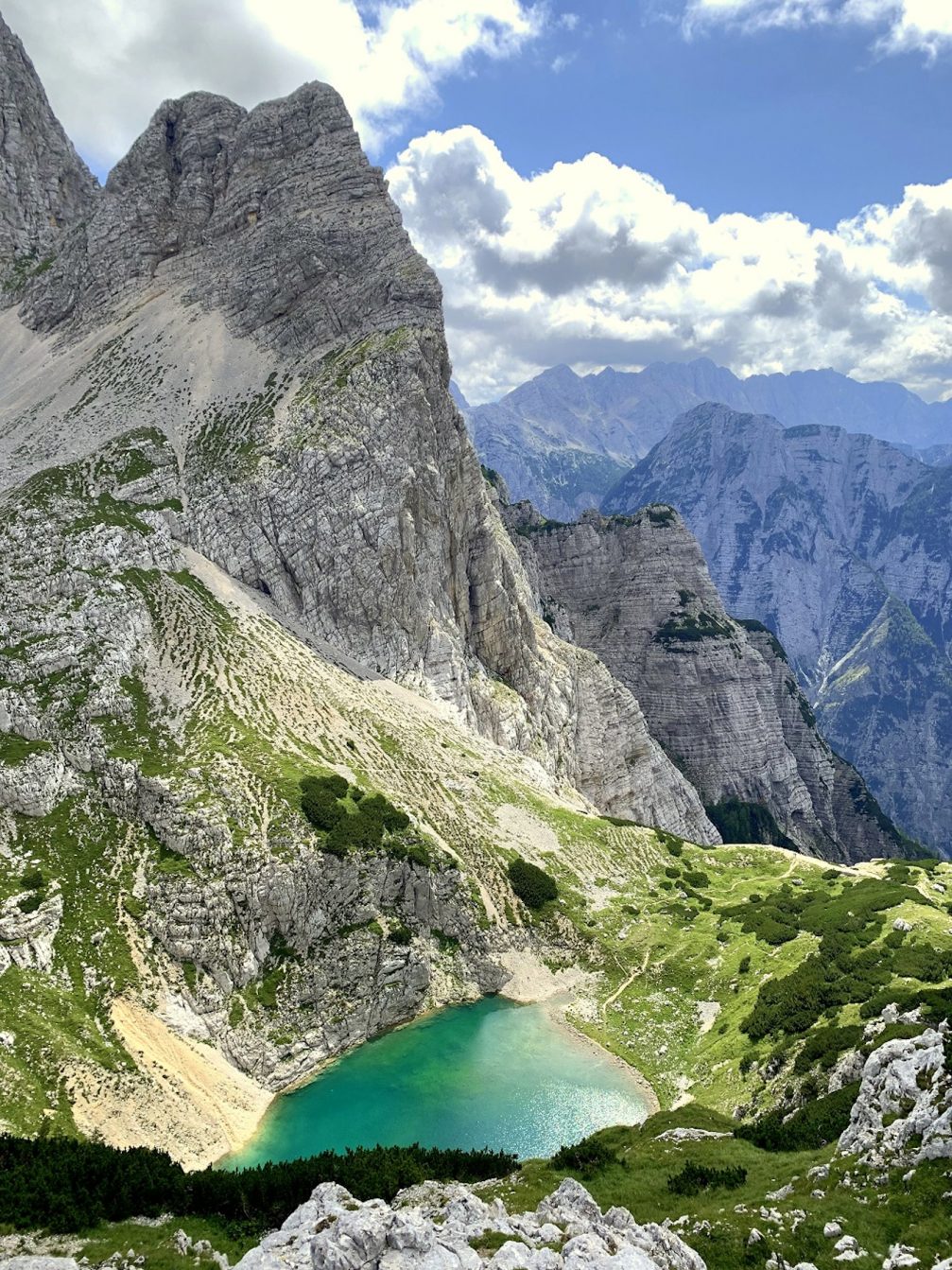 Aerial view Lower Kriz Lake at Kriski Podi high-mountain plateau in Julian Alps in Slovenia.