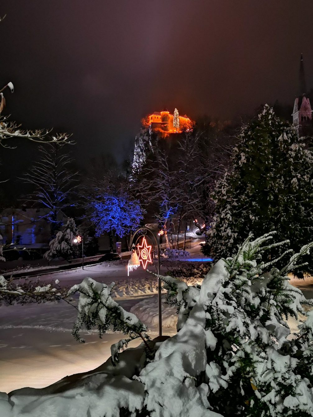 Bled Castle above Lake Bled at night in the holiday season