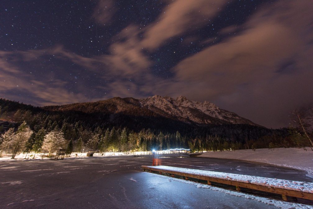 Frozen Lake Jasna at night in the winter with stars in the sky