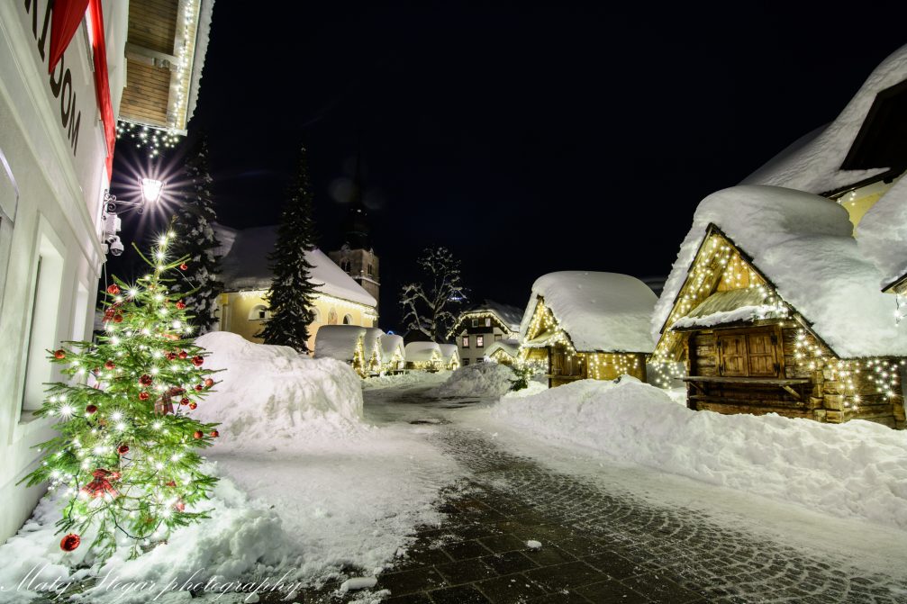 Village of Kranjska Gora covered in snow at night in the Christmas season