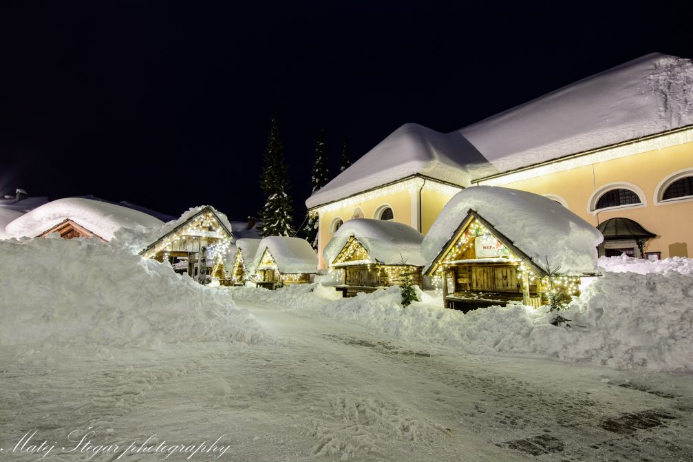 Village of Kranjska Gora, Slovenia, covered in snow at night in the holiday season