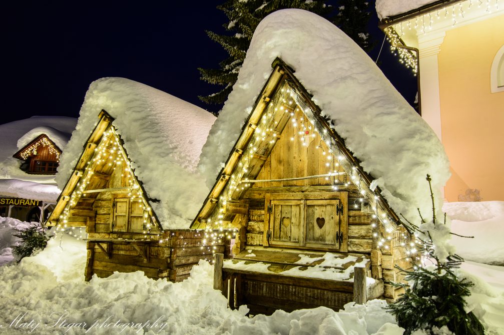 Village of Kranjska Gora covered in snow at night in the holiday season