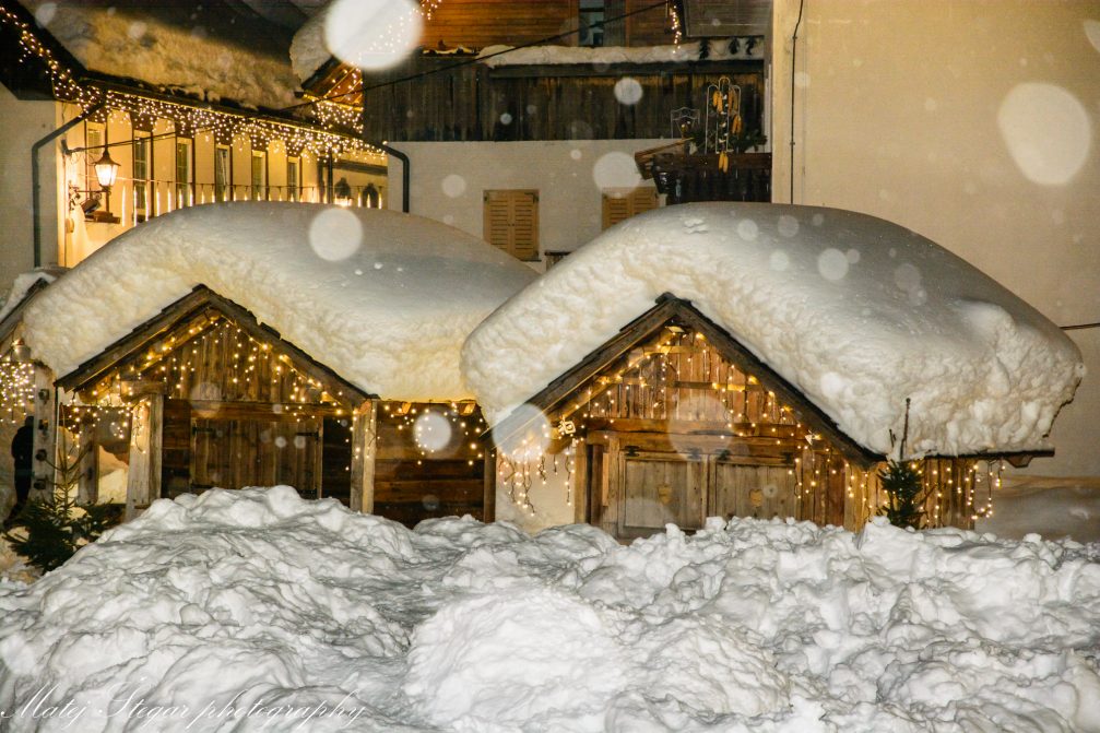 Snowing in the village of Kranjska Gora in Slovenia at night in the winter