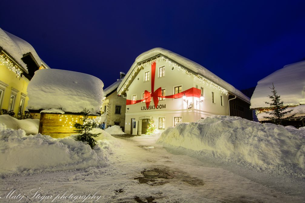 Village of Kranjska Gora in Slovenia covered in snow at night in winter