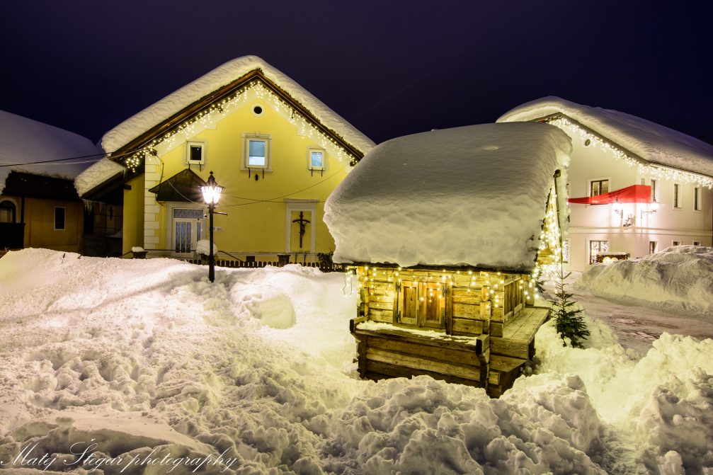 Village of Kranjska Gora, Slovenia, covered in snow at night in winter