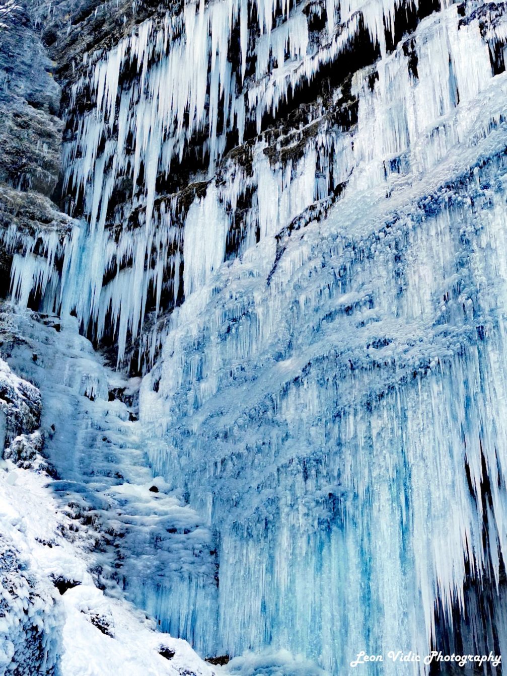 Waterfall Pericnik in Slovenia turned into a wall of icicles and floes in winter