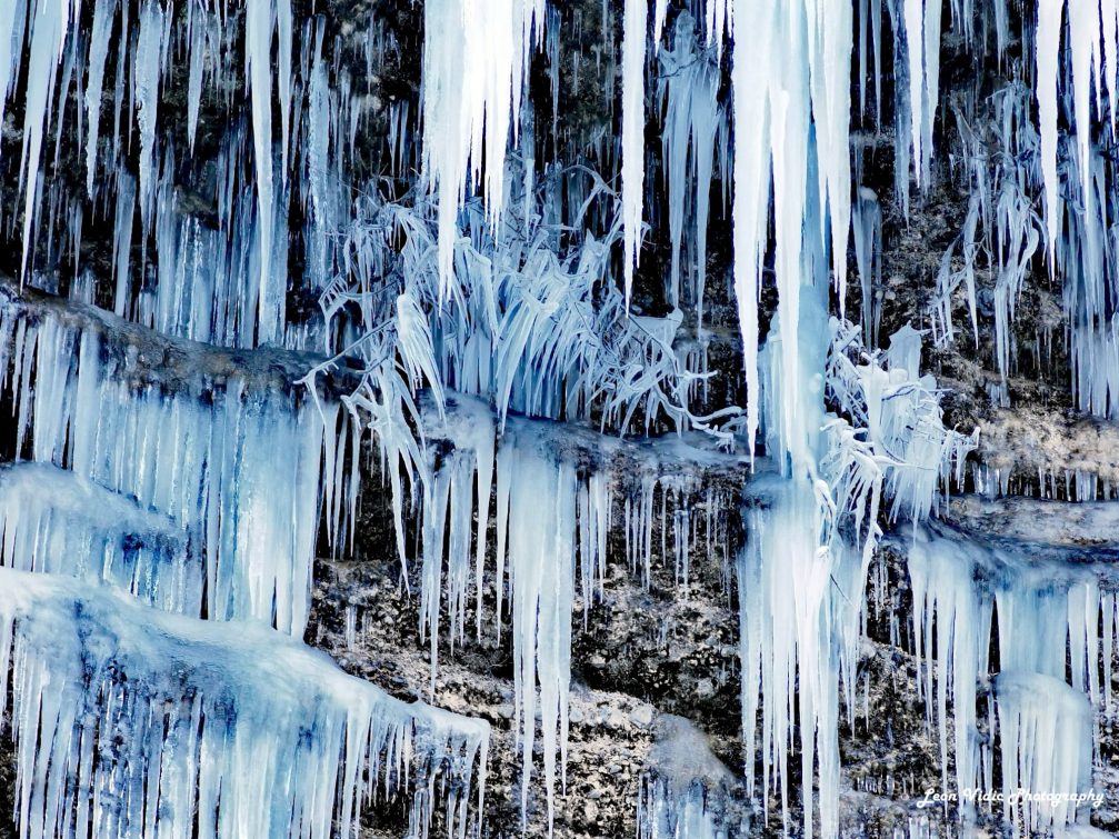 Icicles and floes of the Pericnik Waterfall in winter