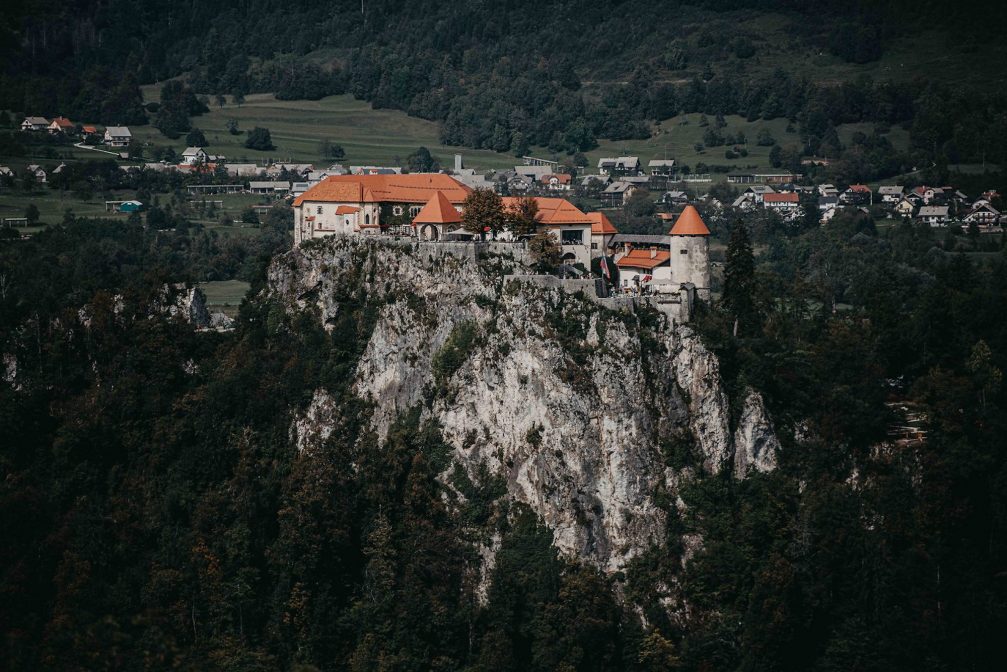 Bled Castle perched atop a steep cliff in Slovenia