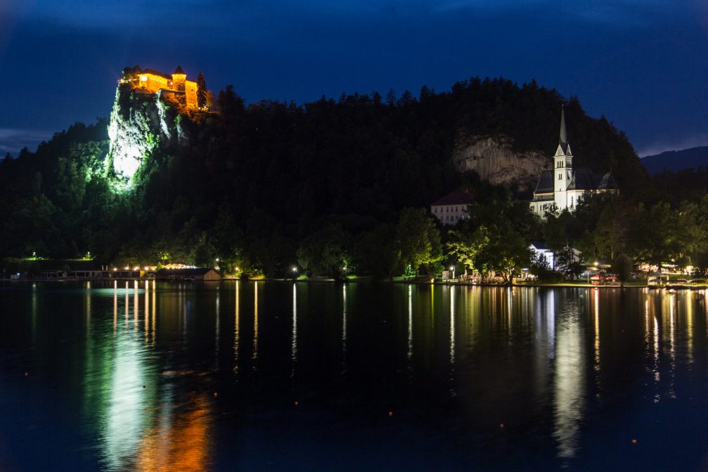 View of the illuminated Bled Castle at night