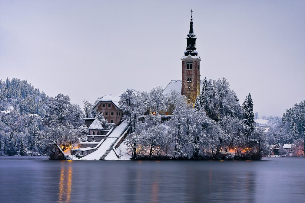 Church on Bled Island covered in snow in the winter