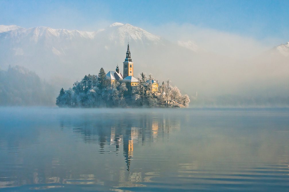 Bled Island covered in snow on a winter morning