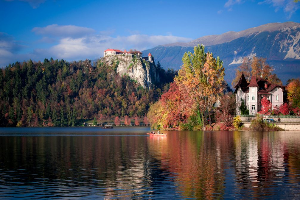 Lake Bled with its medieval castle on the cliff in the fall season