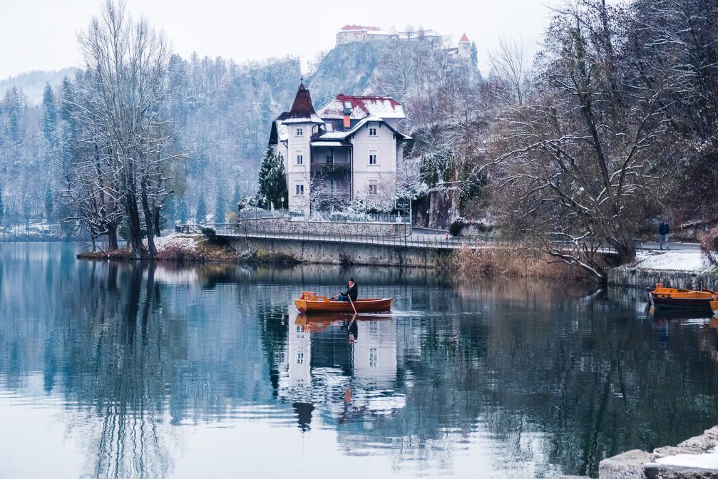A wooden boat on Lake Bled in the winter
