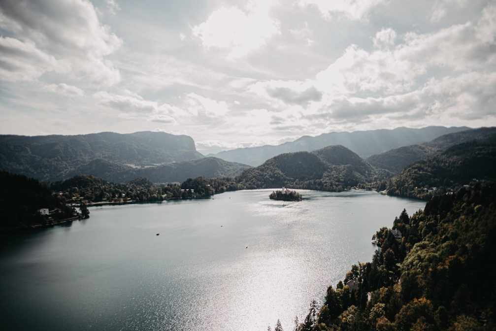 View of Lake Bled and its island from the castle on a cloudy day