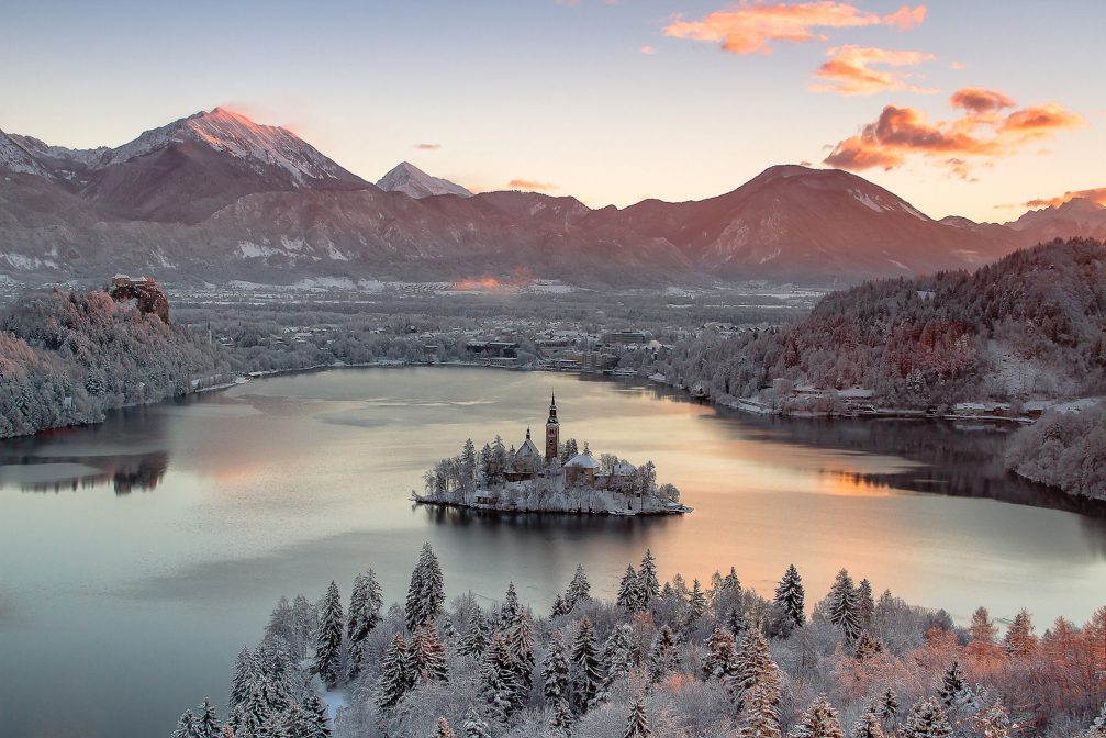 View of Bled Island in the middle of Lake Bled at sunrise in the winter