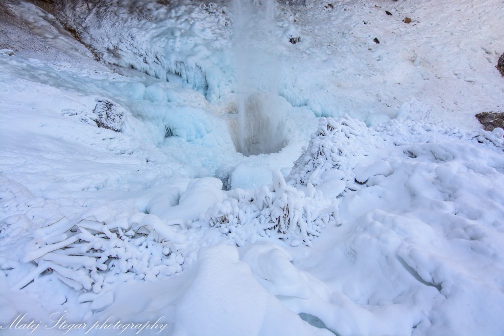 Ice cone which forms at the base of Pericnik Waterfall in winter