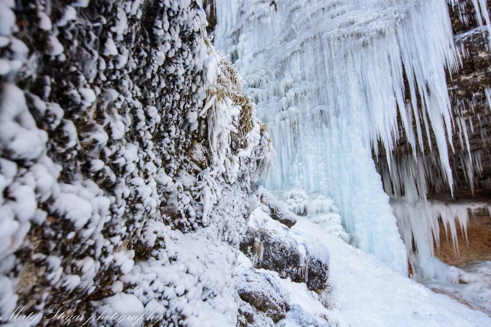 Ice wall behind Waterfall Pericnik in Triglav National Park in winter