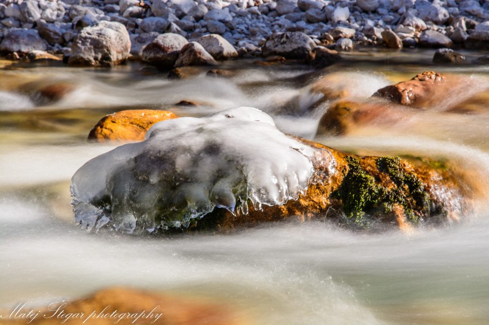 Crystal clear water of Pericnik Stream in Triglav National Park in winter