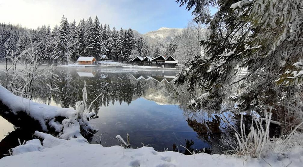 Lake Plansar in Jezersko in winter with Slovenian Alps in the background