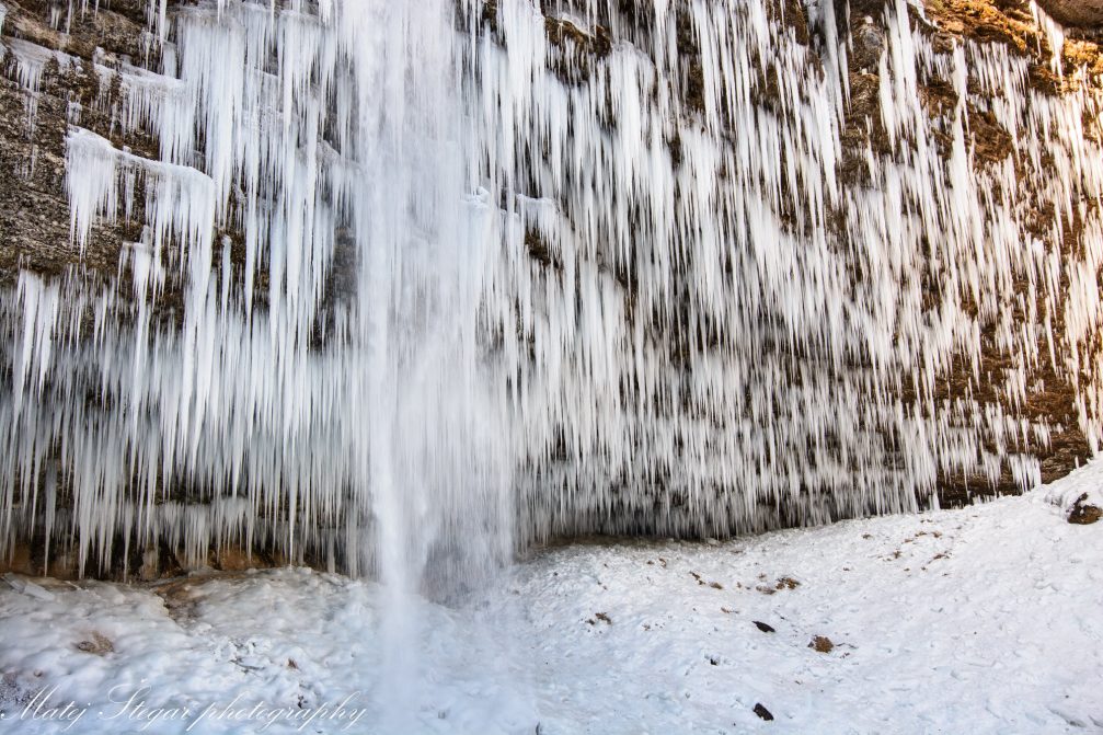 A powerful stream of Pericnik Waterfall in Triglav National Park in winter