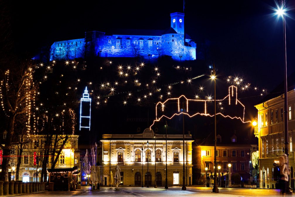 Ljubljana Old Town decorated with Christmas Lights with the hilltop castle in the background