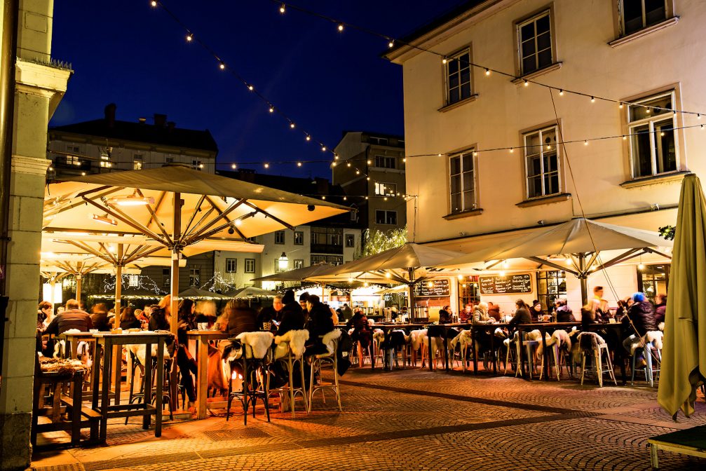 Outdoor cafes in Ljubljana Old Town in the Christmas season at night