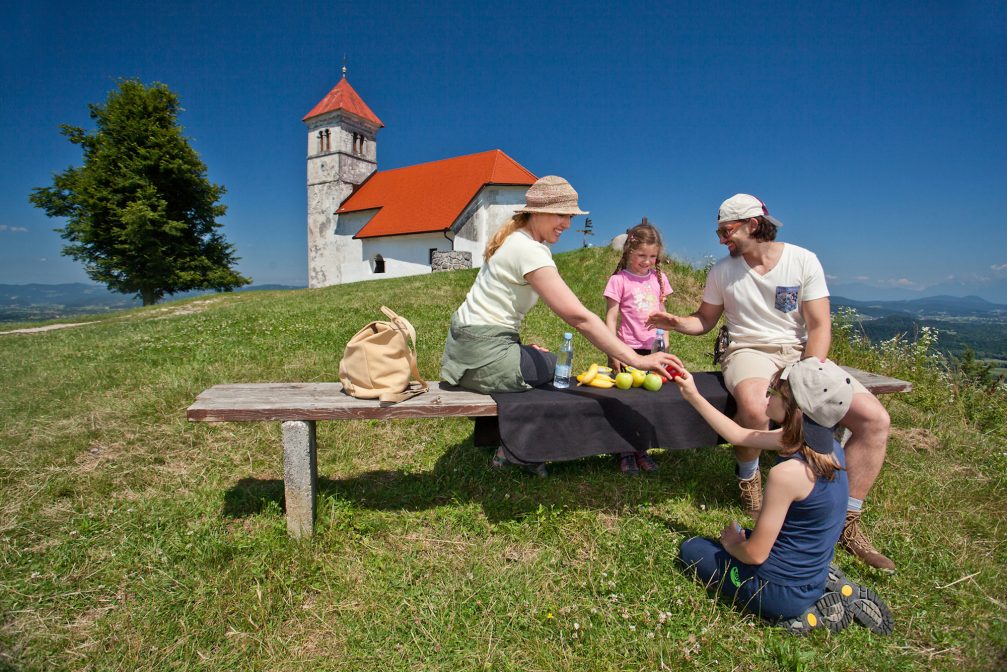 A family at the Church of St. Anne above Ljubljana Marshes