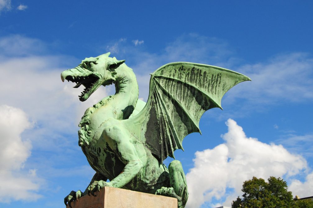 A huge statue of dragon made from sheet copper on Dragon Bridge in Ljubljana