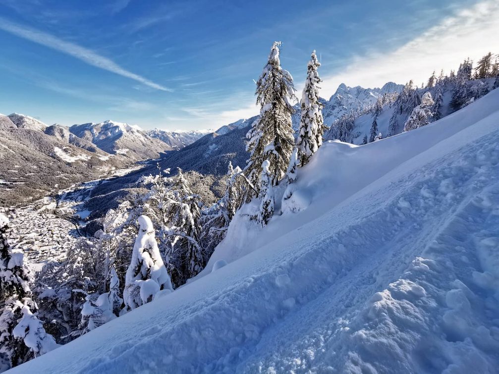 View of Kranjska Gora and Slovenian Alps covered in snow in winter