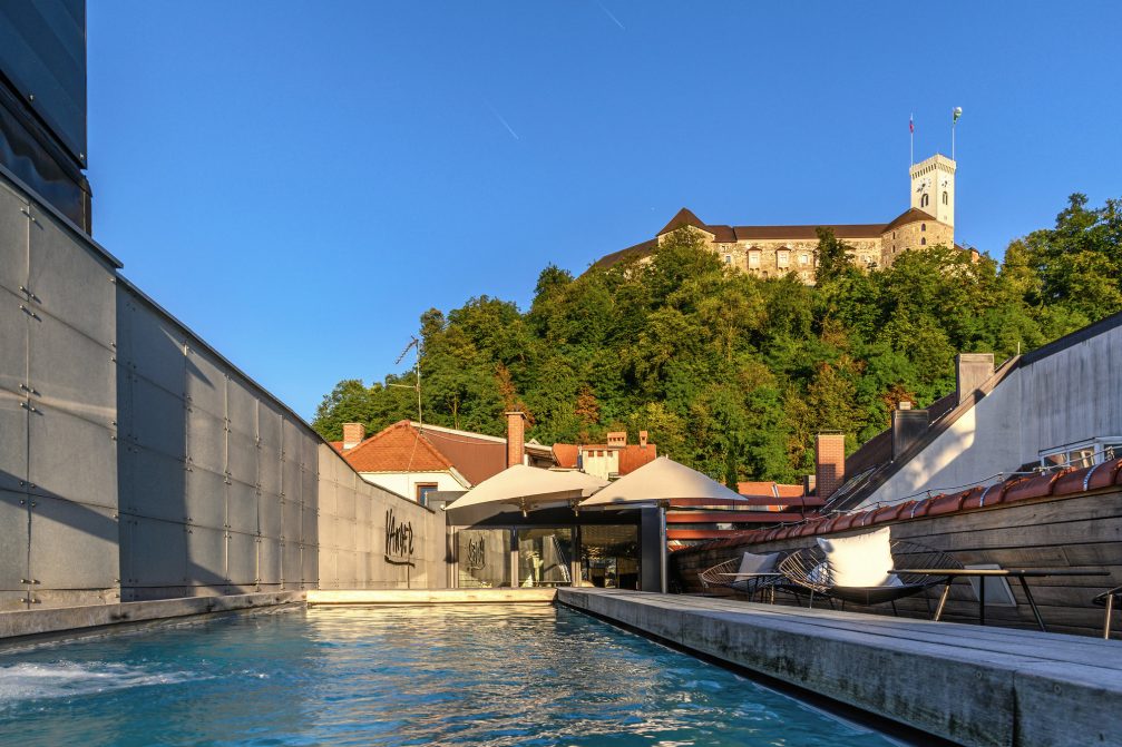 A view of Ljubljana Castle from the rooftop swimming pool at Vander Urbani Resort