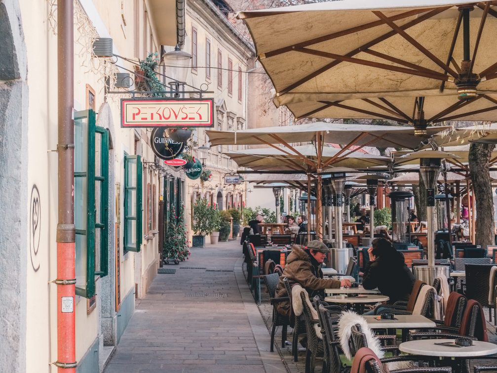 Outdoor cafes in Ljubljana Old Town in Slovenia during colder months