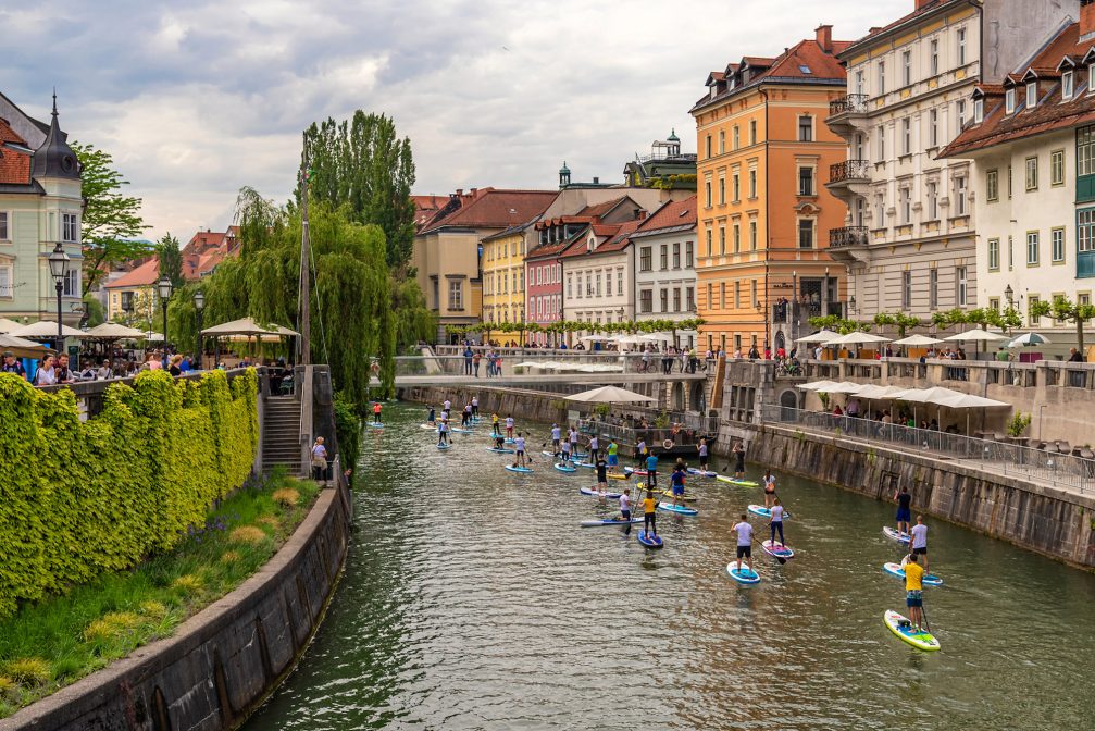 SUP or Stand Up Paddling in Ljubljana Old Town in summer