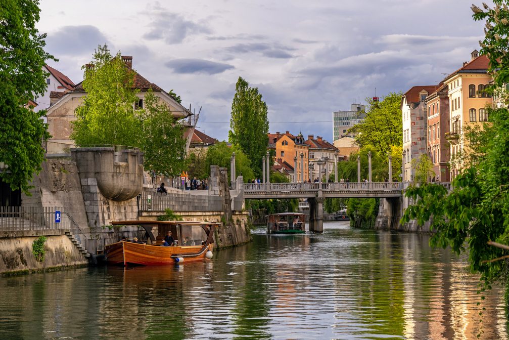 A tourist boat on River Ljubljanica in Ljubljana Old Town