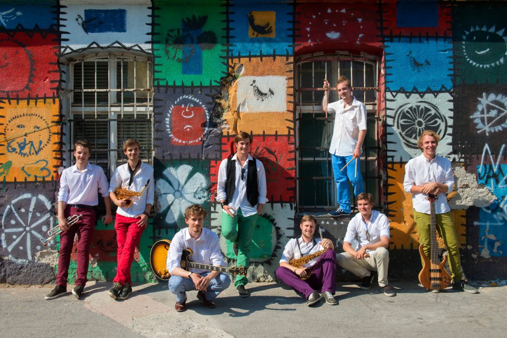 Musicians in front of a typical building in Metelkova in Ljubljana